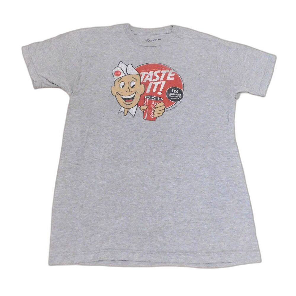 Coca Cola T Shirt 63 Flavors Worldwide Sz. L Grey Front Back Graphics